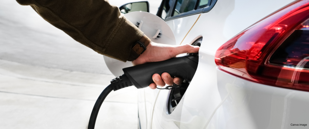Electric vehicle being charged