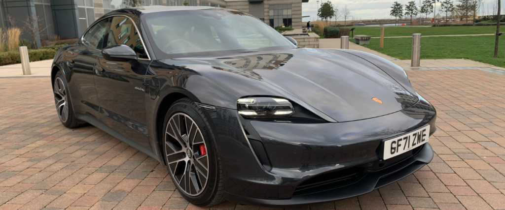 Black Porsche Taycan angled to the right