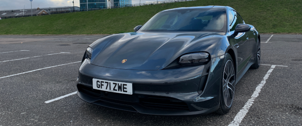 Porsche Taycan angled to the left facing forward.