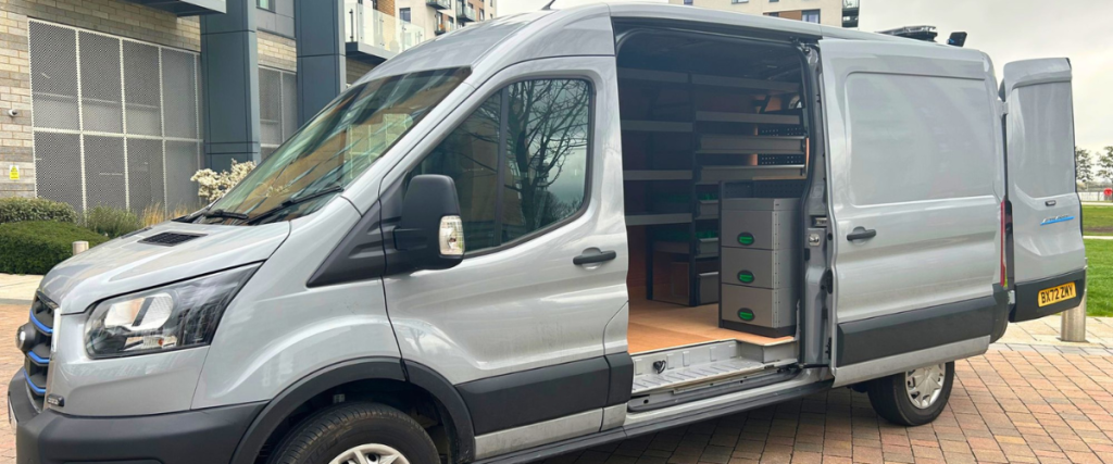 silver ford e-transit with side door open