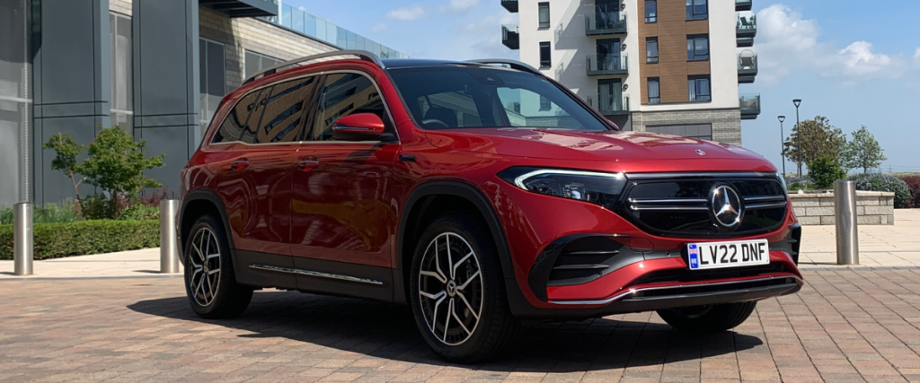 Red Mercedes EQB at an angle to the right