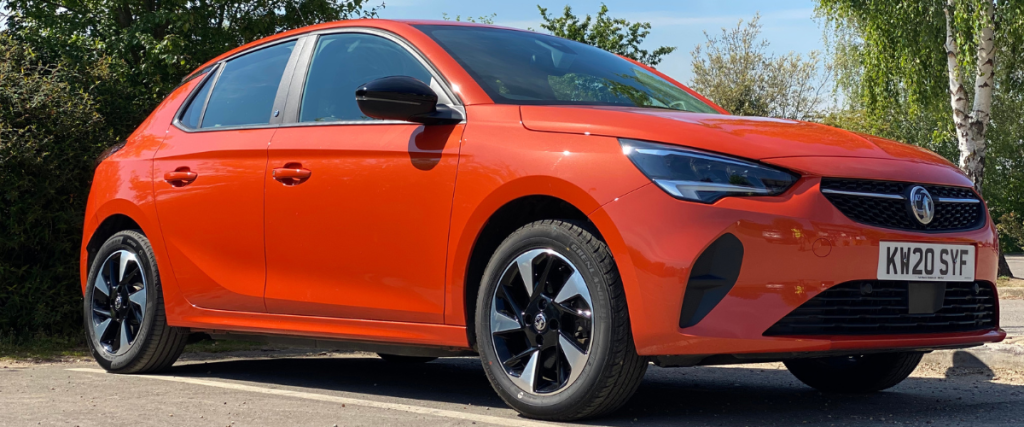 Orange Vauxhall Corsa-e at an angle facing right