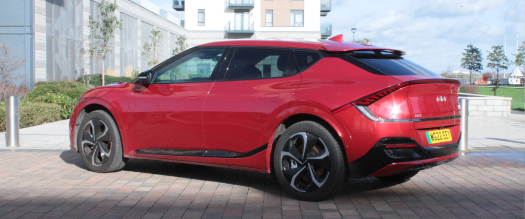 Red Kia EV6 facing away to the left